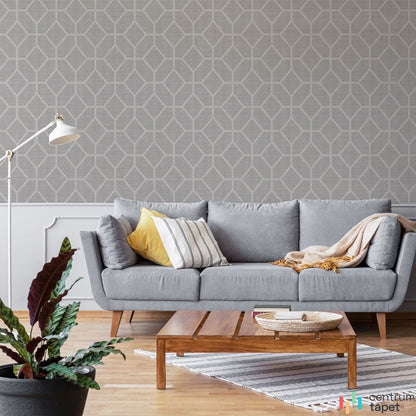 Szara geometryczna ściana z jasną siatką figur przy szarej sofie