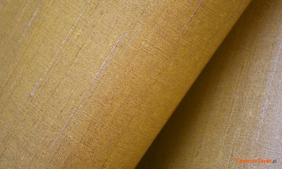Zagięty żółty materiał z niewielkimi jasnymi śladami przeplotu Paleo 50507